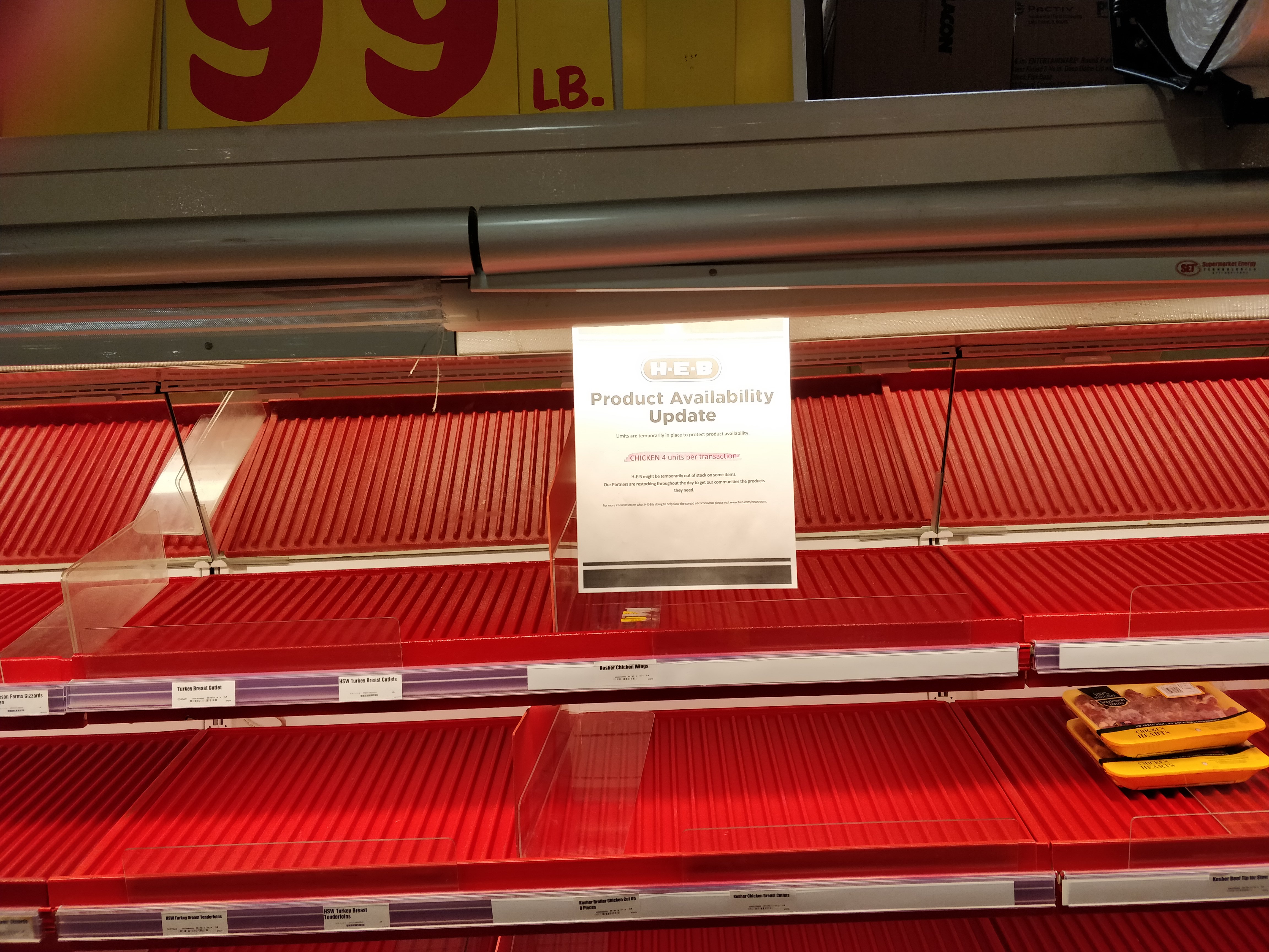grocery store with empty shelves for chicken
